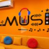 Tranh dán tường music nền cam trang trí cửa hàng music box GPTPT202610611