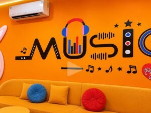Tranh dán tường music nền cam trang trí cửa hàng music box GPTPT202610611